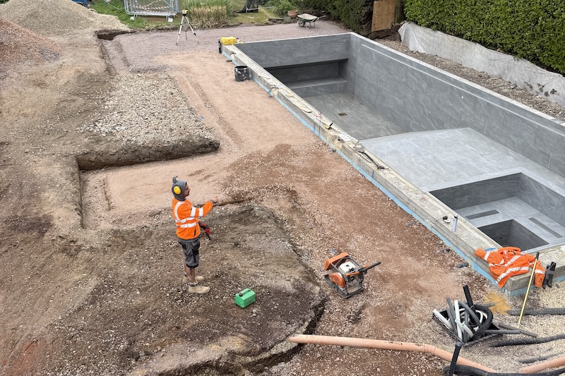 Recent swimming pool and hard landscaping